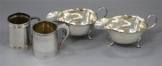 A George V silver christening can, Chester 1910, a plainer christening can and a pair of Mappin & Webb silver sauceboats gross 8oz